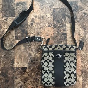 Black and beige throw-over Coach purse